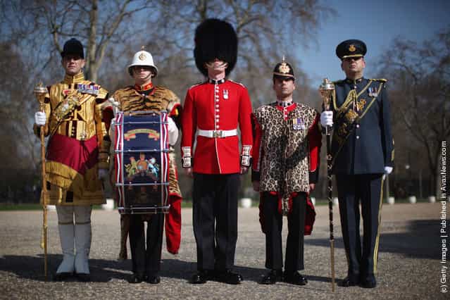 (L-R) Senior Drum Major Betts of the Scotts Guard, Bugler Lee Kidd, Guardsman Adam Deer of the Coldstream Guards and Lance corporal Michael Strong of the Princess of Wales's Royal Regiment pose in their full ceremonial attire at Wellington Barracks