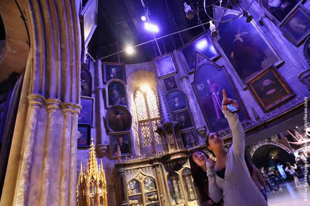 Two girls look around the set of Dumbledores office at the new Harry Potter Studio Tour at the Warner Brothers Leavesden Studios