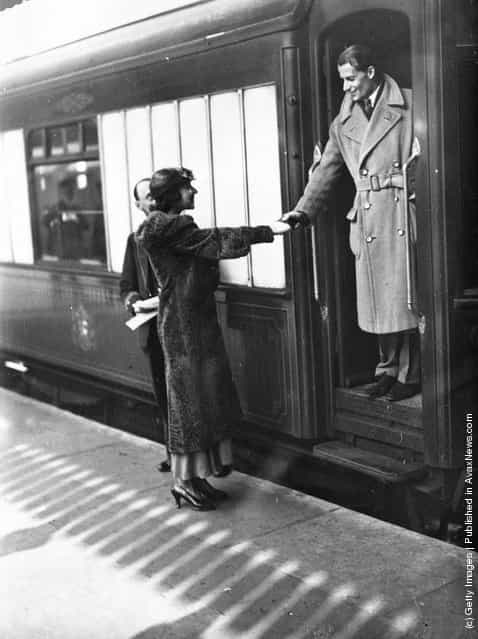 1933: British tennis player Bunny Austin says goodbye to his wife, actress Phyllis Konstam, at Victoria Station, London, as he makes his way to Barcelona to compete in the Davis Cup