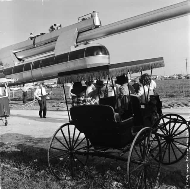 1950: Passengers queue for a free ride on a new monorail service in Houston, Texas