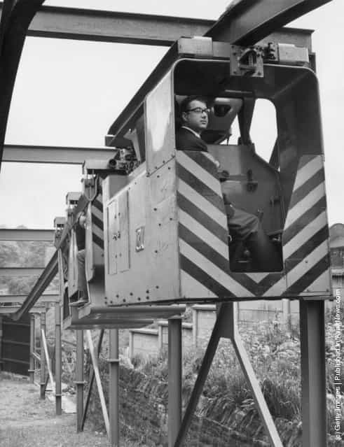 A Monorail Locomotive and Man Riding Carriage devised by Qualter Hall & Co of Yorkshire for use in collieries. It is hoped that it will enable men, supplies and coal to be taken to and from the coal face more quickly, 1965