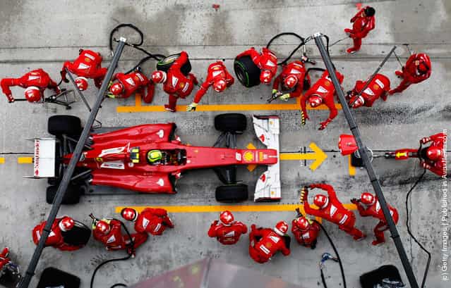 Felipe Massa of Brazil and Ferrari drives in for a pitstop during the Malaysian Formula One Grand Prix at the Sepang Circuit in Kuala Lumpur, Malaysia