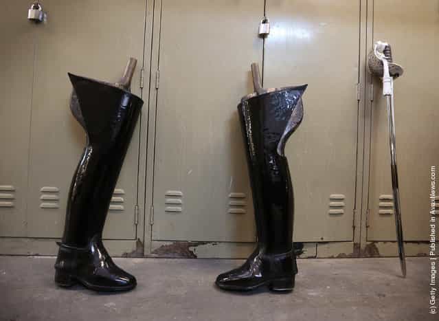 Riding boots and a ceremonial sword await cleaning at The Household Cavalry Mounted Regiment (HCMR) Hyde Park Barracks