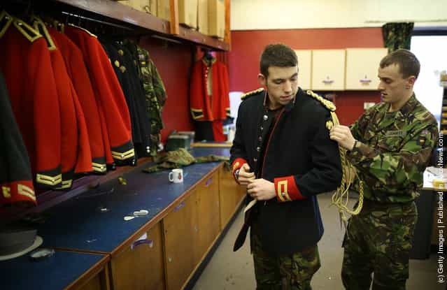 Trooper Matthew Vass (R) fits Trooper Bradley Corbett of The Household Cavalry Mounted Regiment (HCMR) with a Blues and Royals tunic in the Tailor Shop at Hyde Park Barracks