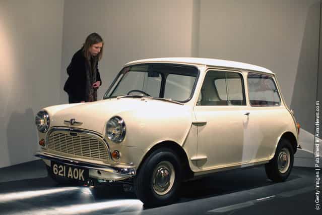 A visitor looks at a Morris Mini-Minor Car on display at the Victoria and Albert museums new major exhibition