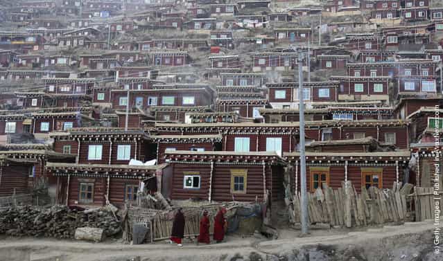 Monastic dormitories stand on the hillside at the Serthar Wuming Buddhist Study Institute in Serthar County of Garze Tibetan Autonomous Prefecture, Sichuan Province, China
