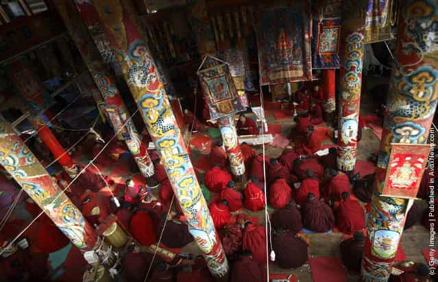 Nuns recite sutras in a hall at the Serthar Wuming Buddhist Study Institute
