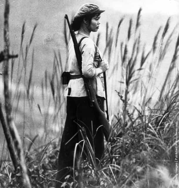 North Vietnamese soldier, Nguen Thi-Hai, standing guard, 1968