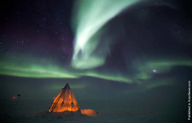 The aurora australis provides a dramatic backdrop to a Scott Tent at Amundsen-Scott South Pole Station on July 14, 2009