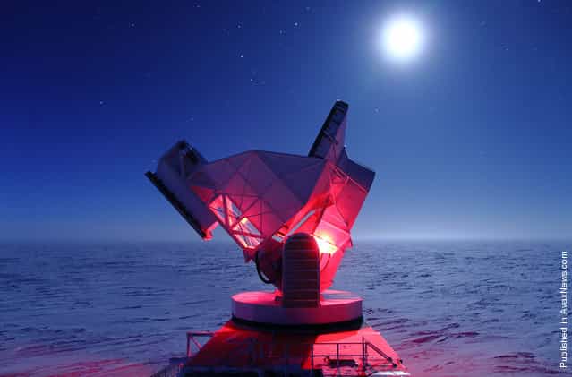 Red lights help maintenance workers doing routine repairs on the South Pole Telescope (SPT) on August 19, 2010