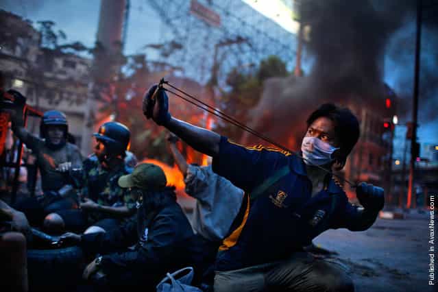 World Press Photo winner of the 2nd prize Spot News Stories of the 2011 World Press Photo contest by Corentin Fohlen, France, Fedephoto, of anti-government riots in Bangkok, Thailand, May 2010