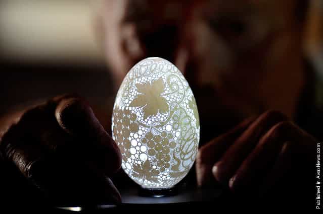 Franc Grom displays one of his special Easter eggshells drilled with more than 20,000 holes in Stara Vrhnika, some 50 kilometers from Ljubljana, Slovenia, on April 22, 2011. Grom, a 70-year old Slovenian craftsman, has been making Easter eggshells into ornaments for the last 18 years
