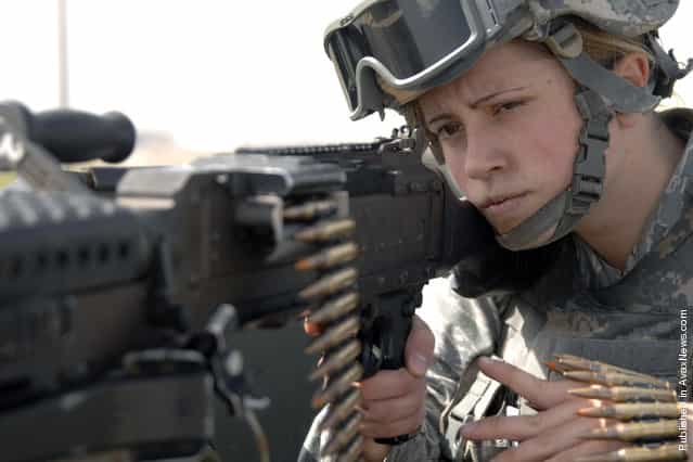 Airman Samantha Allred peers down the barrel of a M240B machine gun while working patrol on the flightline March 9 at Incirlik Air Base, Turkey. Airman Allred, with her fellow 39th Security Forces Squadron personnel, is responsible for providing security for the U.S. Air Forces in Europe's largest weapon's storage area. Women's History Month is celebrated throughout March to highlight American women of the past, present and future, and their accomplishments throughout the years