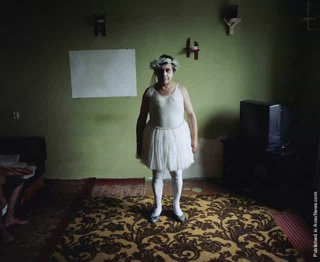 Retired circus artiste Jozef Maksymiuk (59) at home dressed in one of his old costumes