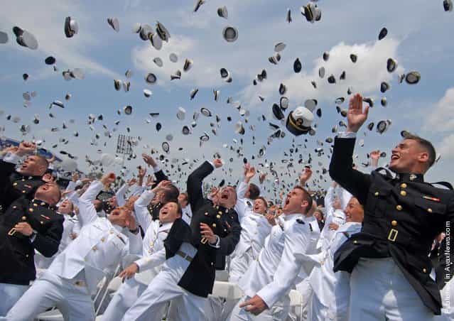Newly commissioned Navy and Marine Corps officers toss their hats after the U.S. Naval Academy Class of 2011 graduation and commissioning ceremony. The Class of 2011 graduated 728 ensigns and 260 Marine Corps 2nd lieutenants at Navy-Marine Corps Memorial Stadium in Annapolis