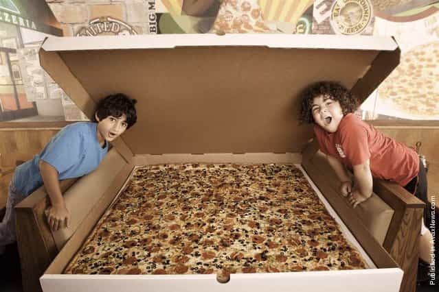 Available on the menu at Big Mamas and Papas Pizzeria in Los Angeles, California, is an enormous four foot, six inch square pizza. Retailing at $199.99 plus tax, this mammoth meal can feed up to 100 people and can be ordered for delivery as long as you give the pizzeria 24 hours notice