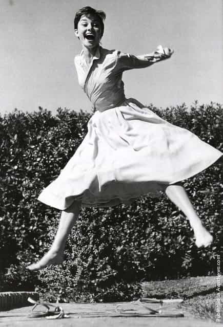 British actress and humanitarian Audrey Hepburn, 1955. Jumpology