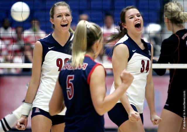 Arizona’s Brooke Buringrud, left, Brittany Leonard, and Paige Weber celebrate a point during the first game of their match against Oregon State on senior day at McKale Center Nov. 23, 2008 in Tucson, Ariz