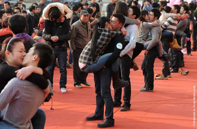 Couples participate in a kissing contest in Hefei, Anhui province, China