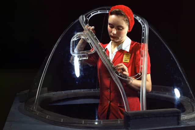 This girl in a glass house is putting finishing touches on the bombardier nose section of a B-17F navy bomber in Long Beach, California, Shes one of many capable women workers in the Douglas Aircraft Company plant. Better known as the Flying Fortress, the B-17F is a later model of the B-17 which distinguished itself in action in the South Pacific, over Germany and elsewhere. It is a long range, high altitude heavy bomber, with a crew of seven to nine men, and with armament sufficient to defend itself on daylight missions. Photo taken in October, 1942