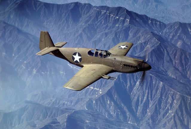 P-51 Mustang fighter in flight, Inglewood, California, The Mustang, built by North American Aviation, Incorporated, is the only American-built fighter used by the Royal Air Force of Great Britain. Photo taken in October, 1942