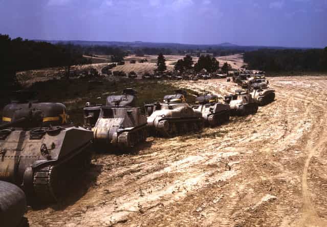 A parade of M-4 (General Sherman) and M-3 (General Grant) tanks in training maneuvers, at Ft. Knox, Kentucky. Note the lower design of the M-4, the larger gun in the turret and the two hatches in front of the turret. Photographed in June of 1942