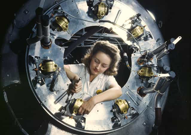 Part of the cowling for one of the motors for a B-25 bomber is assembled in the engine department of North American Aviations Inglewood, California, plant, in October of 1942