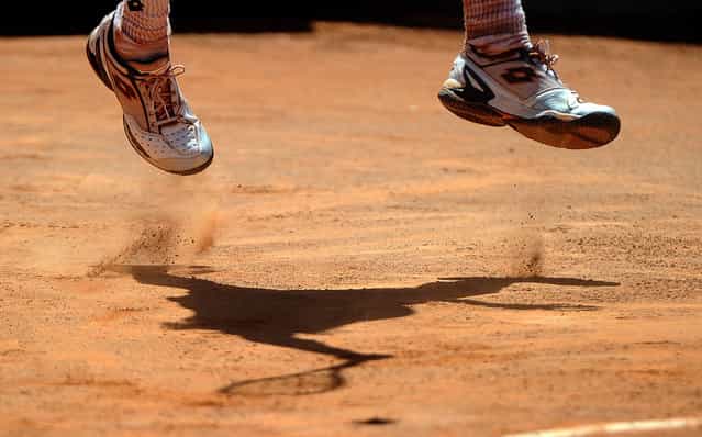 David Ferrer of Spain returns the ball to Gilles Simon of France at the Italian Open Tennis Tournament (ATP and WTA World Tour), in Rome’s Foro Italico