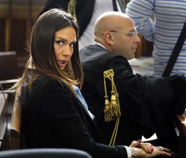 Former showgirl Nicole Minetti looks at the camera during a break in her trial with ex-Italian Premier Silvio Berlusconi aides, Emilio Fede, an executive in Berlusconi's media empire, and talent agent Dario [Lele] Mora, on charges they allegedly recruited an underage Moroccan girl and other women for prostitution at Berlusconi's villas on May 11, 2012