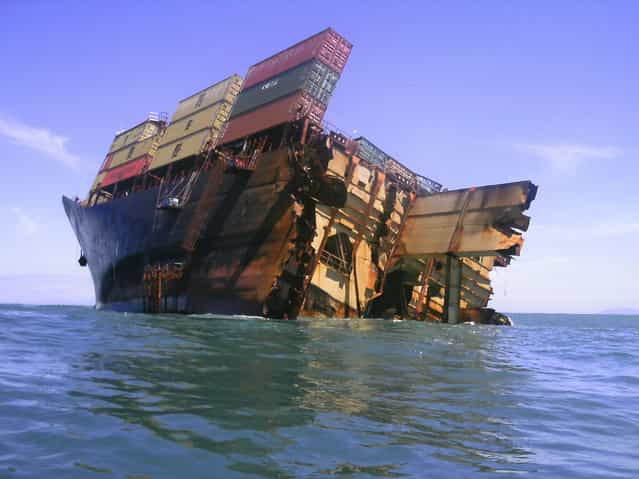 The bow section of the stricken container ship Rena remains above water after the stern broke off and sank about 14 nautical miles (Photo by 22 km) from Tauranga on the east coast of New Zealand’s North Island The bow section of the stricken container ship Rena remains above water after the stern broke off and sank about 14 nautical miles (Photo by 22 km) from Tauranga on the east coast of New Zealand’s North Island