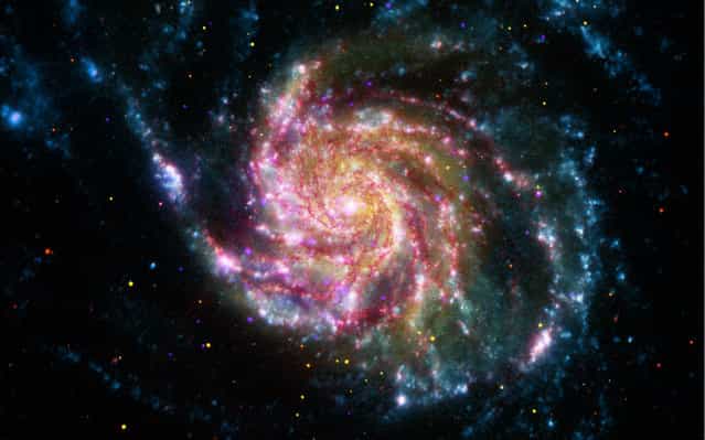 This image of the Pinwheel Galaxy, also known as M101, combines data in the infrared, visible, ultraviolet and X-rays from four of NASAs space-based telescopes