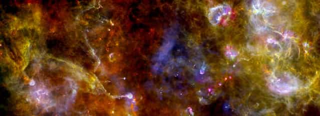 This view of the Cygnus-X complex, released by the European Space Agency on May 10, 2012 highlights chaotic networks of dust and gas that point to sites where massive stars are being formed