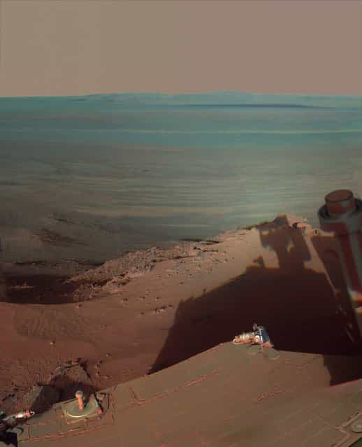NASAs Opportunity rover catches its own late-afternoon shadow in a view looking eastward across Endeavour Crater on Mars