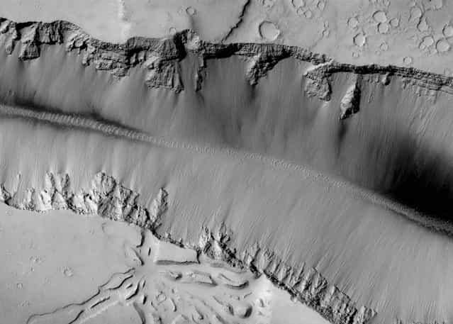 The high-resolution camera on NASAs Mars Reconnaissance Orbiter captured this picture of landforms near Grota Valles on Mars