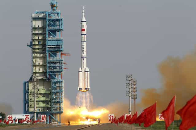 Shenzhou 9 spacecraft rocket launches from the Jiuquan Satellite Launch Center in Jiuquan, China, Saturday, June 16, 2012