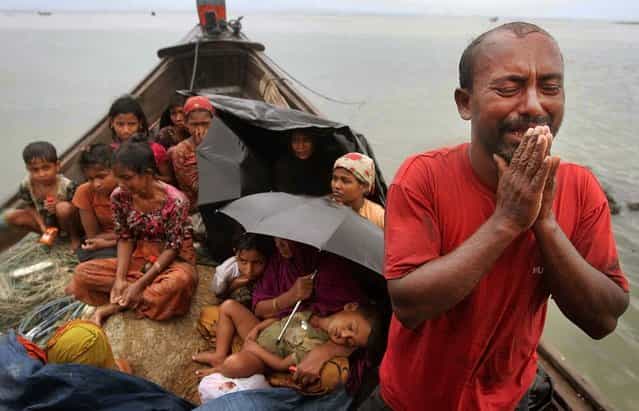 A Rohingya Muslim man who fled Myanmar to Bangladesh to escape religious violence pleads to be allowed into the country after his boat was intercepted by border guards in Taknaf, Bangladesh on June 13, 2012