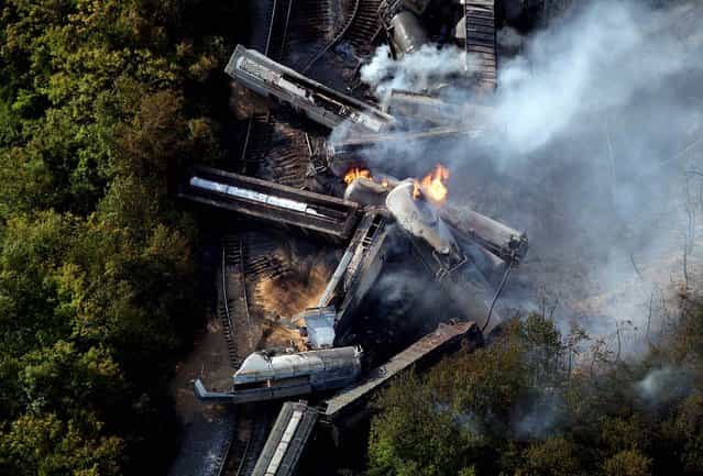 A derailed freight train burns in Columbus, Ohio on July 11, 2012