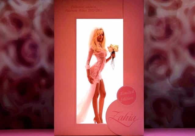 French fashion designer Zahia Dehar appears at the end of her Women's Fall Winter 2013 haute couture fashion collection in Paris