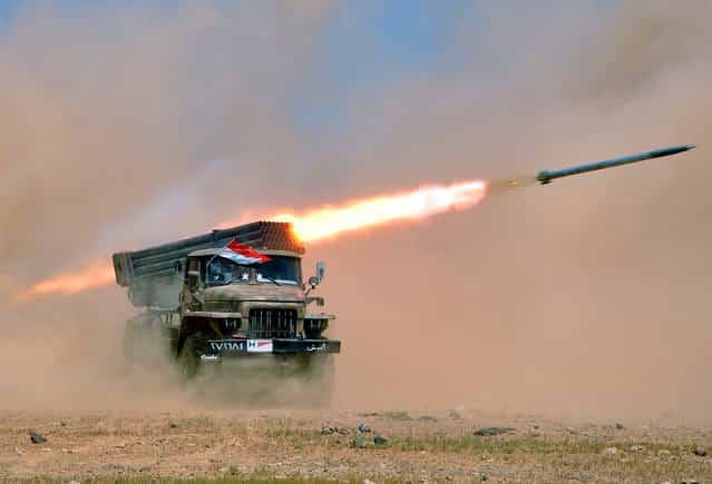 Syrian troops participate in a live fire exercise in an undisclosed location in Syria on July 8, 2012