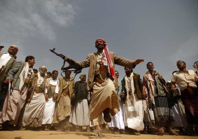 A tribesman, loyal to the al-Houthi Shi'ite rebel group, performs a traditional dance at the conclusion of a two-day tribal gathering in the northwestern Yemeni province of Saada, on the border with Saudi Arabia on July 12, 2012