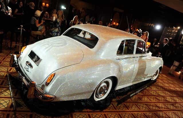 A Rolls Royce Silver Cloud from 1962, which has been adorned with countless Swarovski crystals, is pictured during a charity event at Hotel Vierjahreszeiten in Munich, Germany, 17 July 2012. It took three years to cover the Rolls Royce in about 1,000,000 Swarovski crystals. It is going to be auctioned in the next months in favour of the [Help in Motion] charity. (Photo by Tobias Hase)