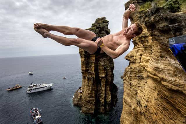Alain Kohl of Luxembourg dives from the 28 meter platform during the third stop of the Red Bull Cliff Diving World Series, in Islet Vila Franca do Campo, Azores, Portugal on July 21, 2012. (Photo by Dean Treml via Romina Amato/Red Bull)