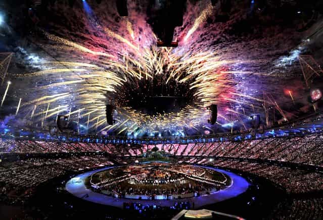 Fireworks light up the Olympic Stadium during the opening ceremony for the 2012 Summer Olympics in London on Juky 27, 2012. (Photo by Anthony Devlin/PA)