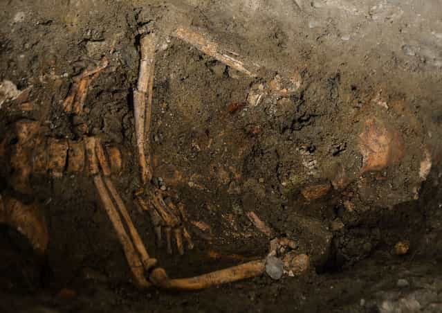 A view of the third excavation of a grave inside the medieval Convent of Saint Ursula in Florence on July 17, 2012, during research focusing on the burial site of Lisa Gherardini, wife of the wealthy Florentine silk merchant Francesco del Giocondo, the model who inspired Leonardo da Vinci's painting [The Mona Lisa]. (Photo by Andreas Solaro/AFP)