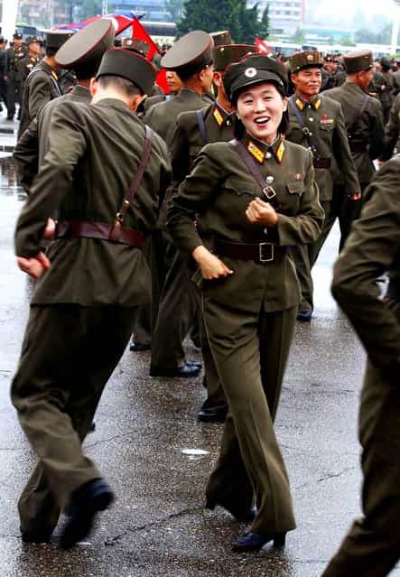 North Korean soldiers dance in the plazas of Pyongyang after the country announced that leader Kim Jong Un was granted the title of marshal, a move that cements his status at the top of the nation s military as he makes key changes to the 1.2 million-man force on July 18, 2012. (Photo by Kim Kwang Hyon/Associated Press)