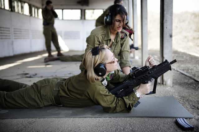 [Womens Affairs Advisor to the Chief of Staff Practices Marksmanship], November, 2010. Pictured here in the Mitkan Adam base, the Womens Affairs Advisor to the IDF Chief of Staff, Brigadier General Gila Kalifi-Amir, practices her marksmanship skills with the guidance of a Marksmanship Instructor during an event for IDF staff officers. The Womens Affairs Advisor to the Chief of Staff is responsible for addressing the unique needs and successful integration of female soldiers into the IDF. She heads the Womens Affairs Advisor unit whose responsibilities include: research, information and advocacy for women serving in the IDF, professional guidance regarding womens affairs, and the representation of the IDFs female soldiers to the media and to the general public.