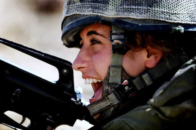 [Infantry Instructors Course], August 25, 2009. The Field Training Week in Southern Israel, part of the IDF Infantry Instructors course, includes individual and group drills, navigation practice, sleeping in the field and camouflage training. At the end of the course the female soldiers will be placed in different positions instructing IDF Ground Forces.