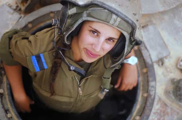 [Tank Instructor Says Hi]. A tank instructor during her training course surfaces for a second to say hello, 2012.