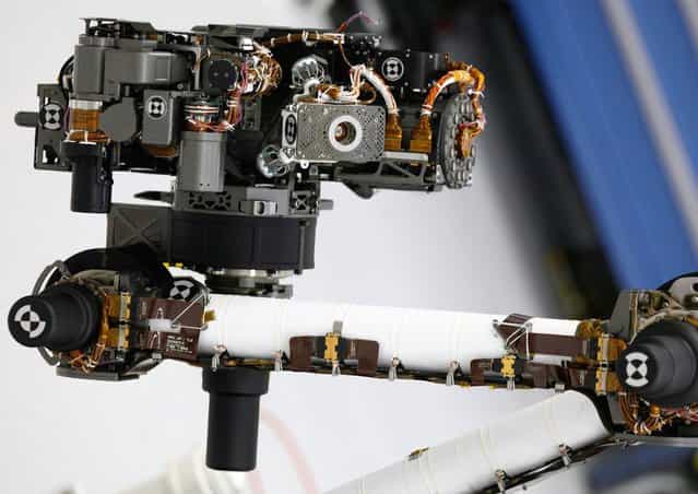 The hand lens imager is mounted on the arm of NASAs Mars rover Curiosity at the Jet Propulsion Laboratory in Pasadena, California, on April 4, 2011. The imager will take extreme close-up pictures of the planets rocks and soil, as well as any ice it may find there. (Photo by Damian Dovarganes/AP Photo)