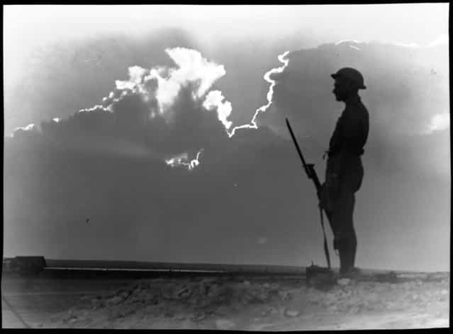 El Alamein (lone soldier on guard in silhouette). Between 1914 and 1945